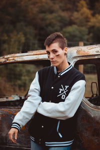 Portrait of young man standing outdoors