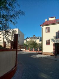 Empty walkway along buildings