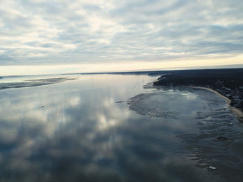 Scenic view of sea against sky at sunset