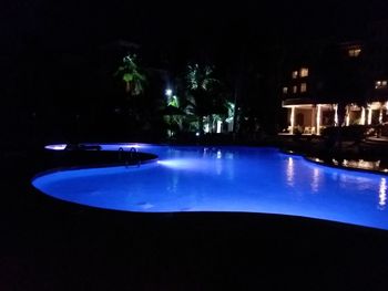 Illuminated swimming pool at night
