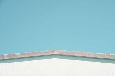 Low angle view of swimming pool against clear blue sky