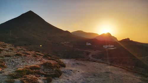 Scenic view of mountains against sky during sunset