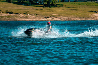 Man jet ski driving in lake