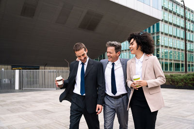 Business colleagues standing in city