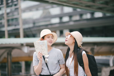 Tourists standing in city