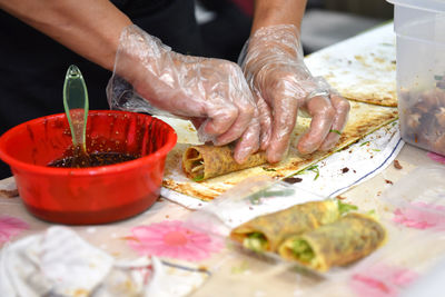 Close-up of person preparing food