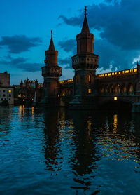 Reflection of illuminated buildings in water