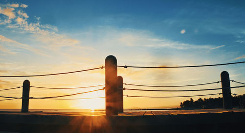 Low angle view of silhouette bridge against sky during sunset