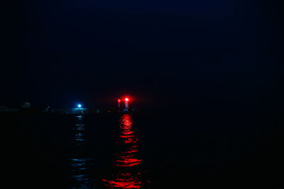 Scenic view of sea against sky at night