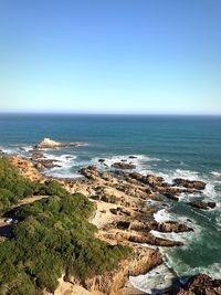 Scenic view of sea against clear blue sky