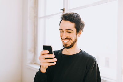 Young man using mobile phone