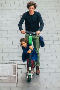 Full length portrait of smiling boy and son