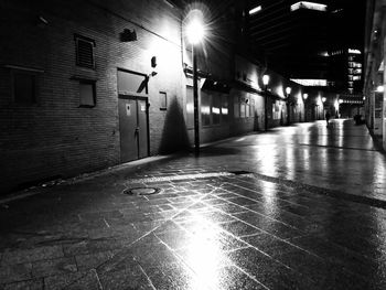 Illuminated street lights in city at night