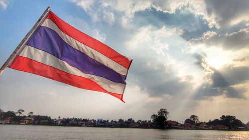 Low angle view of flag against sky