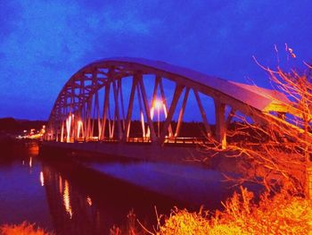 Bridge over river at night