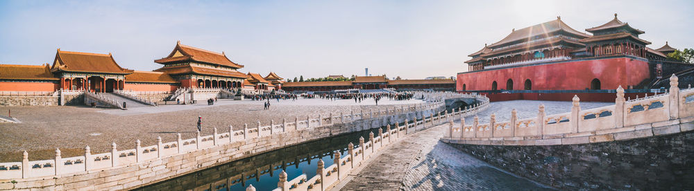 Panoramic view of buildings against sky in city