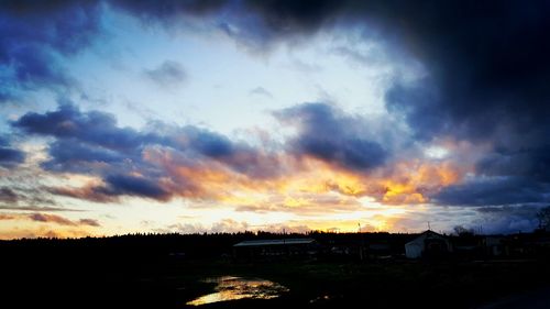 Scenic view of cloudy sky at sunset