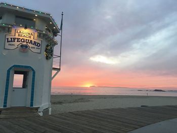 Scenic view of beach against sky during sunset