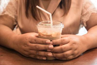 Close-up of woman drinking glass