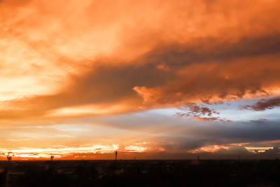 Low angle view of dramatic sky during sunset