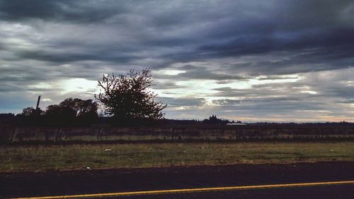 Scenic view of landscape against cloudy sky