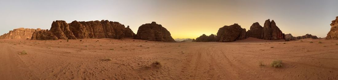 Panoramic view of arid landscape against sky