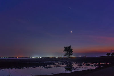 Scenic view of sea against sky at night