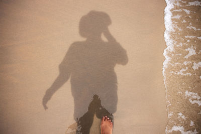 Shadow of people on beach