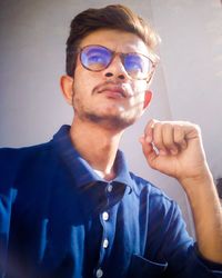 Portrait of young man wearing sunglasses