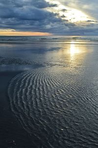 Scenic view of sea against cloudy sky