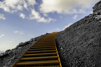 Low angle view of steps against sky