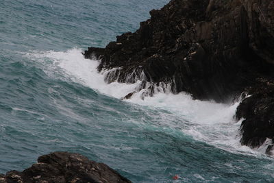 Sea waves splashing on rocks