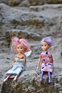 Close-up of dolls on rock