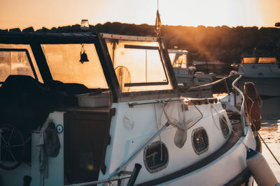 Boats moored in sea against sky