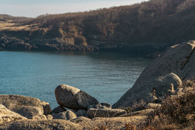 Scenic view of sea against mountain