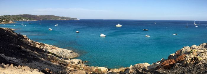 High angle view of boats sailing in sea against sky