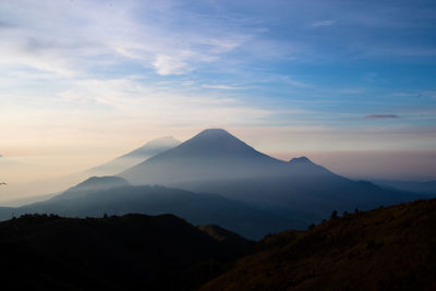 Scenic view of mountains against sky during sunset