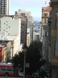 Street amidst buildings in city against sky