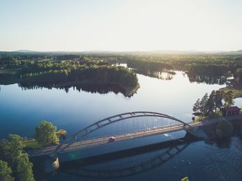 High angle view of trees by river against sky