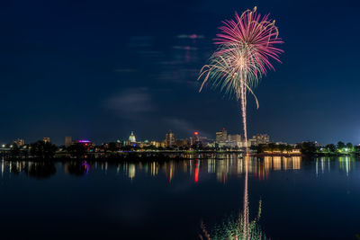 Reflection of firework display at night