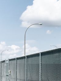 Close-up of metal against sky