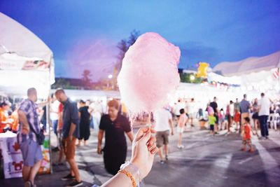 Hand holding cotton candy