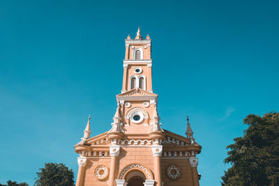 Low angle view of building against blue sky