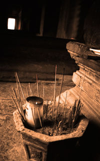 Close-up of illuminated lamp in temple