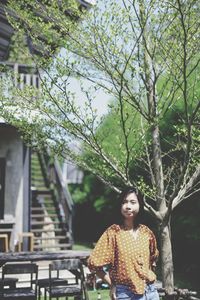 Portrait of a smiling young woman sitting outdoors