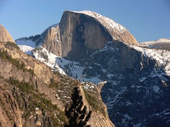 Panoramic view of snowcapped mountains against clear sky