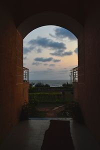 Buildings seen through arch window