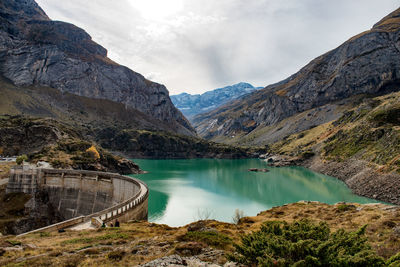 Scenic view of lake and mountains against sky