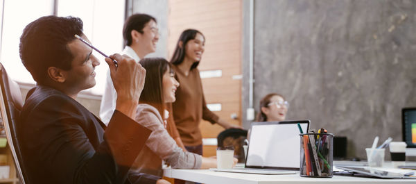 Group of people working on table