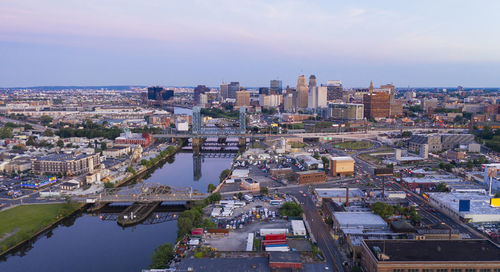 High angle view of buildings in city against sky